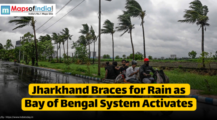 Jharkhand Braces for Rain as Bay of Bengal System Activates People ride motorcycles along a wet road lined with swaying palm trees under dark, cloudy skies in Jharkhand, as the region braces for rain due to an active Bay of Bengal weather system.