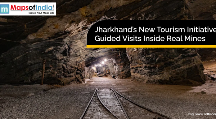 Jharkhand’s New Tourism Initiative: Guided Visits Inside Real Mines An underground mine tunnel with railway tracks and artificial lighting, representing Jharkhand’s new tourism initiative offering guided visits inside real mines.
