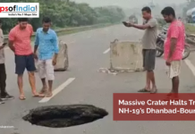 Massive Crater Halts Traffic on NH-19’s Dhanbad-Bound Lane People gather around a large crater that has formed on NH-19's Dhanbad-bound lane, causing a traffic halt; concrete barriers are placed nearby for safety.