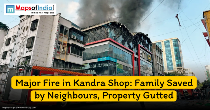 Thick black smoke rises from a commercial building in Kandra as a major fire engulfs a shop; fire trucks and rescue teams are visible at the scene.