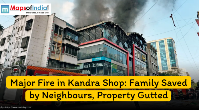 Major Fire in Kandra Shop: Family Saved by Neighbors, Property Gutted Thick black smoke rises from a commercial building in Kandra as a major fire engulfs a shop; fire trucks and rescue teams are visible at the scene.