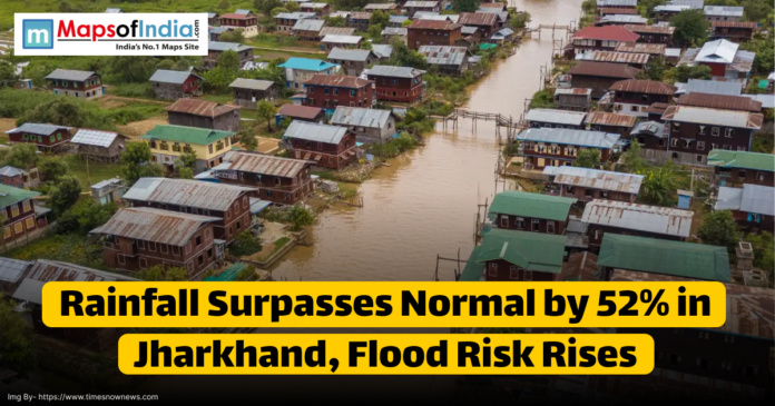 Aerial view of a flooded village area in Jharkhand with houses surrounded by muddy water due to heavy rainfall; text overlay reads 