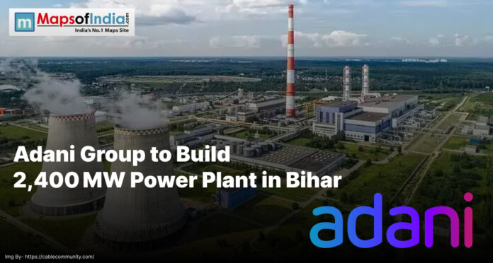 Aerial view of a large industrial power plant with cooling towers and chimneys, highlighting the Adani Group’s upcoming 2,400 MW power project in Bihar.