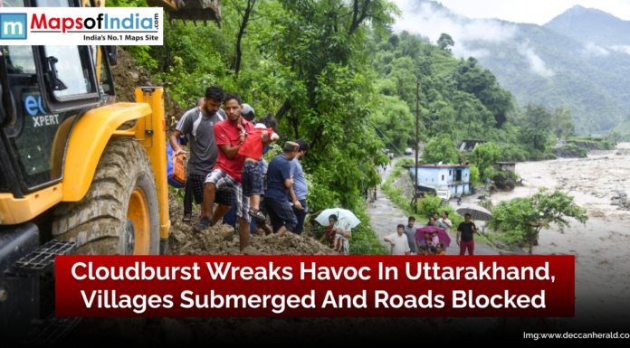 Cloudburst Wreaks Havoc in Uttarakhand, Villages Submerged and Roads Blocked Flooded villages and blocked roads in Uttarakhand after a devastating cloudburst, with houses submerged and transport disrupted.