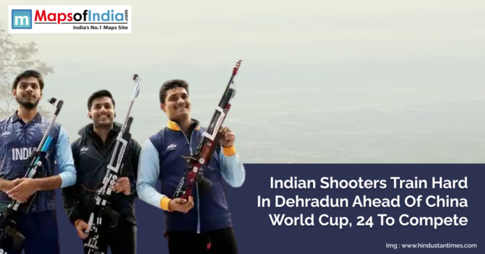 Indian shooters holding rifles and smiling during training in Dehradun ahead of the Shooting World Cup in China, with 24 athletes set to compete.