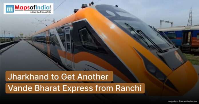 Orange and white Vande Bharat Express train at a railway station, with text overlay stating 'Jharkhand to Get Another Vande Bharat Express from Ranchi' and Maps of India logo.