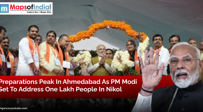 Preparations Peak in Ahmedabad as PM Modi Set to Address One Lakh People in Nikol Prime Minister Narendra Modi addressing a gathering in Ahmedabad with BJP leaders on stage, decorated with flower garlands, ahead of a massive public rally in Nikol.