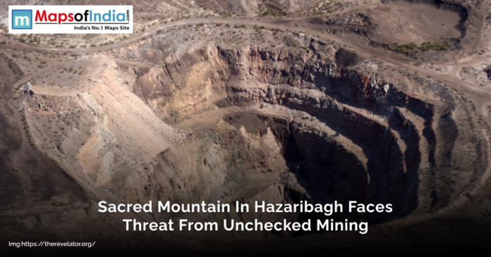Aerial view of a large mining site cutting into a mountain in Hazaribagh, illustrating environmental degradation with the text overlay “Sacred Mountain In Hazaribagh Faces Threat From Unchecked Mining”
