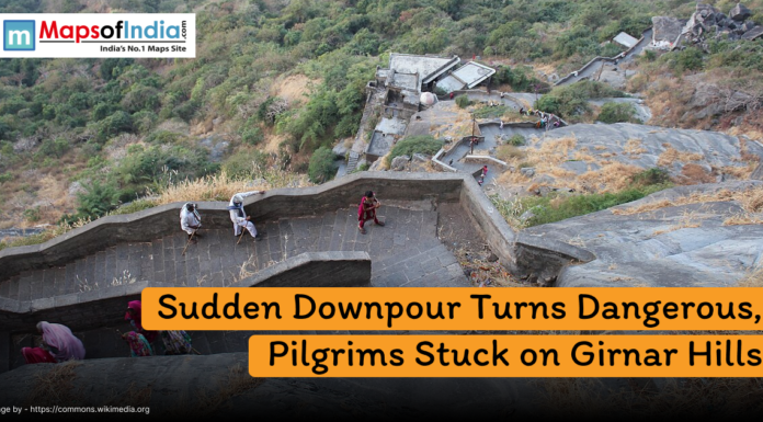 Sudden Downpour Turns Dangerous, Pilgrims Stuck on Girnar Hills Pilgrims climbing the steep stone steps of Girnar Hills in Gujarat, with surrounding greenery, where sudden downpour has left many stranded as highlighted in the news headline.