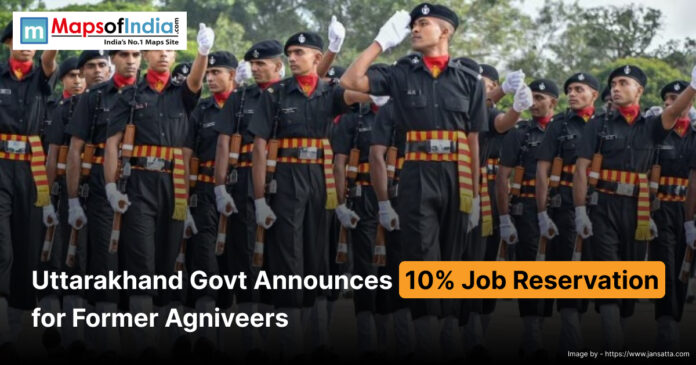 Group of Agniveer soldiers in uniform marching in formation, with a headline announcing that the Uttarakhand government has approved 10% job reservation for former Agniveers.