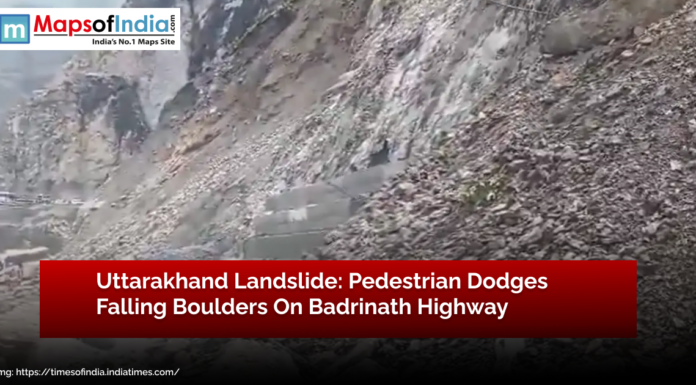 Uttarakhand Landslide: Pedestrian Dodges Falling Boulders on Badrinath Highway Uttarakhand landslide on Badrinath Highway showing debris and falling boulders as a pedestrian narrowly escapes danger.