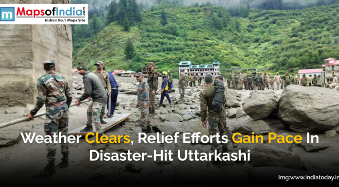 Weather Clears, Relief Efforts Gain Pace in Disaster-Hit Uttarkashi Indian Army personnel engaged in relief and rescue operations amid cleared weather in disaster-hit Uttarkashi, with damaged terrain and buildings in the background.