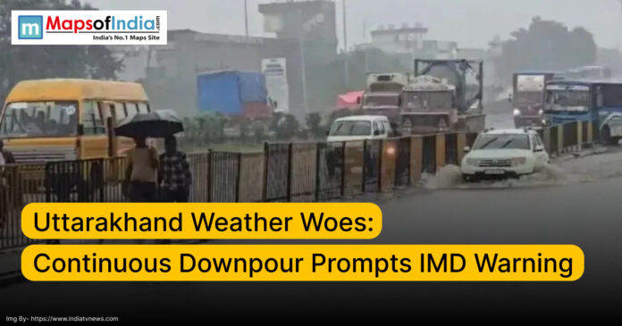 Heavy rain in Uttarakhand causes waterlogging on roads, with vehicles moving through flooded streets and pedestrians using umbrellas; IMD issues weather warning.