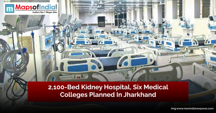 Hospital ward with multiple rows of empty modern hospital beds equipped with medical monitors and equipment, representing the planned 2,100-bed kidney hospital and six new medical colleges in Jharkhand.