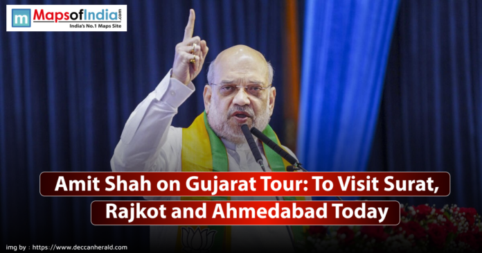Image of Amit Shah speaking at a podium with a raised finger, wearing glasses and a green and yellow scarf, with text overlay stating 
