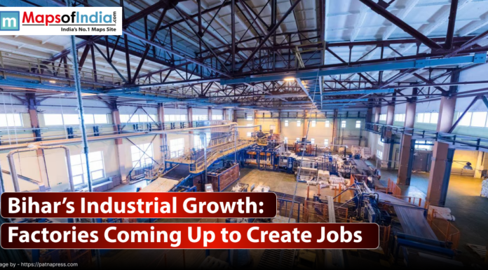 Bihar’s Industrial Growth: Factories Coming Up to Create Jobs A wide-angle, interior shot of a large, modern factory floor. The space is filled with industrial machinery, pipes, conveyor belts, and other equipment.