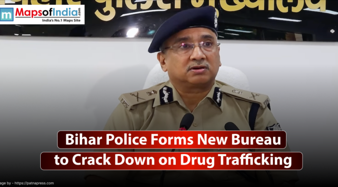 Bihar Police Forms New Bureau to Crack Down on Drug Trafficking A medium close-up of a police officer, dressed in a formal uniform, sitting at a desk and speaking. The text "Bihar Police Forms New Bureau to Crack Down on Drug Trafficking" is superimposed on a dark, solid banner at the bottom of the image.