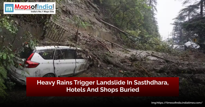A landslide in Sasthdhara triggered by heavy rains, with a car trapped under debris, fallen trees, and mud covering the road