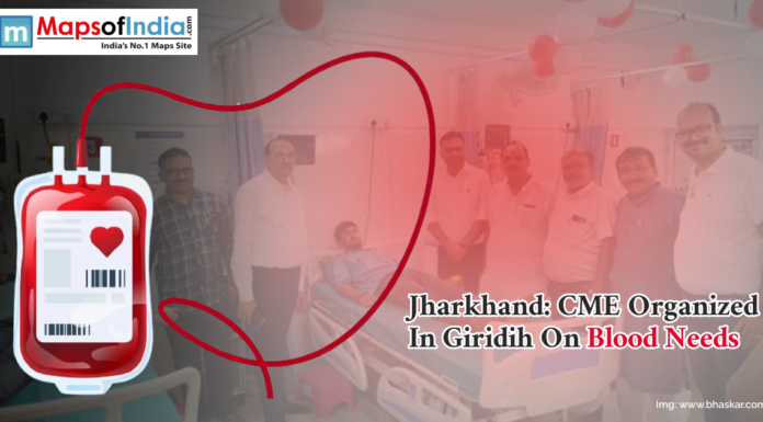 Jharkhand: CME Organized in Giridih on Blood Needs A group of people standing in a hospital room with a patient lying on a bed, overlaid with a graphic of a red blood bag and tubing, alongside text about a CME event on blood needs organized in Giridih, Jharkhand.