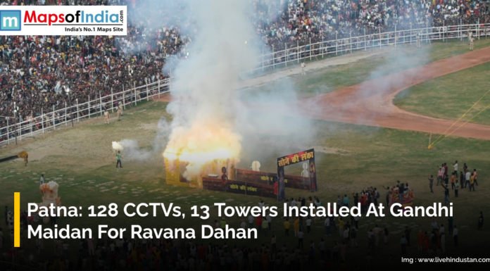 Patna: 128 CCTVs, 13 Towers installed at Gandhi Maidan for Ravana Dahan A large crowd watches the burning of a Ravana effigy at Gandhi Maidan in Patna during Ravana Dahan, with smoke rising and the event monitored by installed CCTV cameras and towers.
