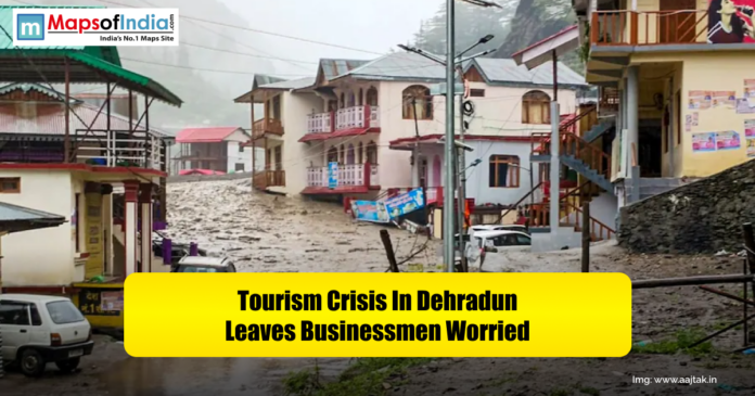 Flooded street scene in Dehradun with damaged buildings and vehicles, conveying a tourism crisis that has left local businessmen worried.