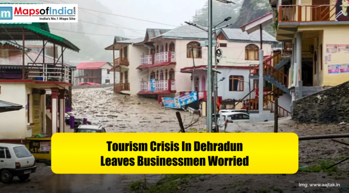 Tourism Crisis in Dehradun Leaves Businessmen Worried Flooded street scene in Dehradun with damaged buildings and vehicles, conveying a tourism crisis that has left local businessmen worried.