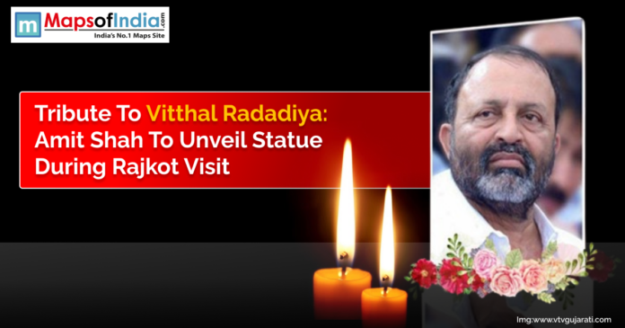 Tribute poster of Vitthal Radadiya with news headline stating Amit Shah to unveil his statue during Rajkot visit, alongside candles and floral decoration.