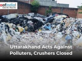 Large piles of industrial waste and garbage are seen inside a walled area in Uttarakhand, highlighting government action against polluters and the closure of illegal crushers.