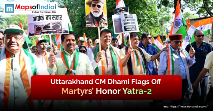 Uttarakhand CM Pushkar Singh Dhami flags off Martyrs’ Honor Yatra-2 with supporters holding placards and Indian flags during a patriotic rally.