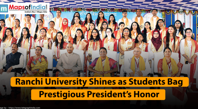 Ranchi University Shines as Students Bag Prestigious President’s Honor A group photo shows students and faculty members at a convocation ceremony. A large banner at the bottom reads "Ranchi University Shines as Students Bag Prestigious President's Honor.