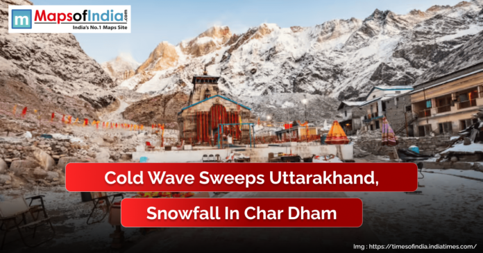 Snow-covered Kedarnath Temple in Uttarakhand surrounded by the Himalayas after fresh snowfall. The image highlights the impact of a cold wave sweeping through the region, with a caption reading “Cold Wave Sweeps Uttarakhand, Snowfall in Char Dham” and the Maps of India logo displayed at the top.