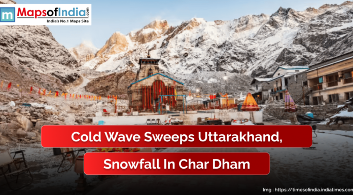 Cold Wave Sweeps Uttarakhand, Snowfall in Char Dham Snow-covered Kedarnath Temple in Uttarakhand surrounded by the Himalayas after fresh snowfall. The image highlights the impact of a cold wave sweeping through the region, with a caption reading “Cold Wave Sweeps Uttarakhand, Snowfall in Char Dham” and the Maps of India logo displayed at the top.