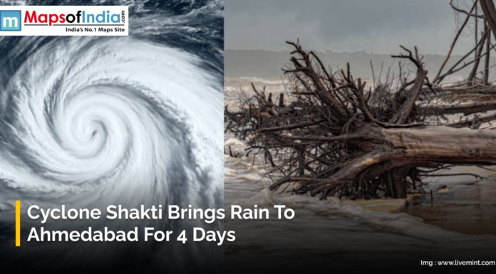 Cyclone Shakti Brings Rain to Ahmedabad for 4 Days Image showing a powerful cyclone formation over the ocean and fallen trees along a flooded coastline. The text reads “Cyclone Shakti Brings Rain to Ahmedabad for 4 Days,” with the Maps of India logo at the top.
