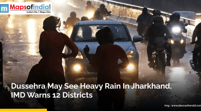 Dussehra May See Heavy Rain in Jharkhand, IMD Warns 12 Districts People walk and ride motorcycles on a wet road during heavy rain in Jharkhand, with vehicles' headlights on in low visibility. A news alert from Maps of India reports that the IMD has warned of heavy rainfall in 12 districts of Jharkhand during Dussehra.