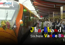 Jharkhand to Get Six New Vande Bharat Trains Image showing a decorated Vande Bharat Express train at a railway station with a crowd gathered to celebrate its launch, accompanied by the text “Jharkhand to Get Six New Vande Bharat Trains.”