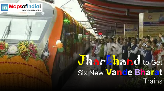 Jharkhand to Get Six New Vande Bharat Trains Image showing a decorated Vande Bharat Express train at a railway station with a crowd gathered to celebrate its launch, accompanied by the text “Jharkhand to Get Six New Vande Bharat Trains.”