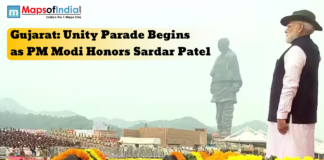 Gujarat: Unity Parade Begins as PM Modi Honors Sardar Patel Prime Minister Narendra Modi stands before the Statue of Unity in Gujarat during the Unity Parade, honoring Sardar Vallabhbhai Patel amidst floral decorations.