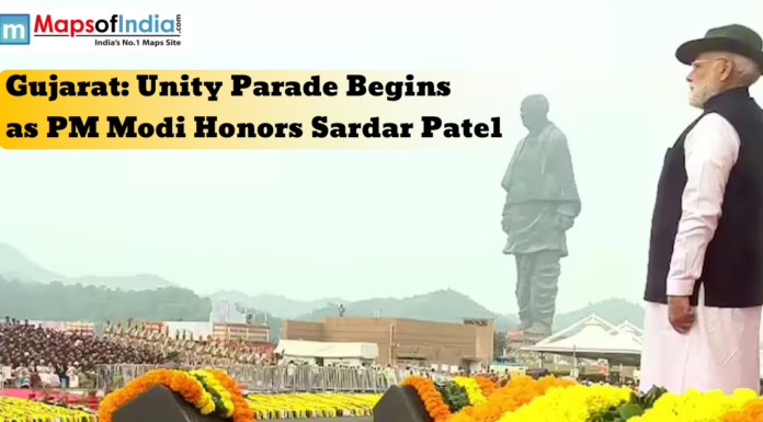 Gujarat: Unity Parade Begins as PM Modi Honors Sardar Patel Prime Minister Narendra Modi stands before the Statue of Unity in Gujarat during the Unity Parade, honoring Sardar Vallabhbhai Patel amidst floral decorations.