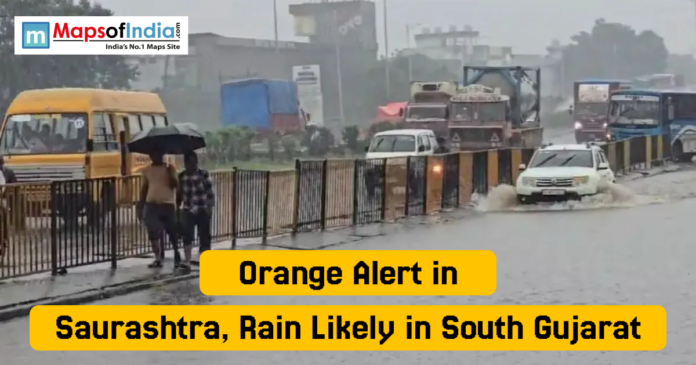 orange alert Vehicles move slowly through a waterlogged road as people walk under umbrellas during heavy rain in Gujarat, with the headline “Orange Alert in Saurashtra, Rain Likely in South Gujarat”