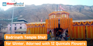 Badrinath Temple Shut for Winter, Adorned with 12 Quintals Flowers Badrinath Temple decorated with marigold flowers as devotees gather before its closure for winter, set against a backdrop of mountainous terrain.