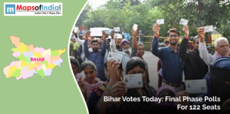 Bihar Votes Today: Final Phase Polls for 122 Seats Voters in Bihar stand in line showing their ID cards as they participate in the final phase of polling for 122 assembly seats during the state elections.