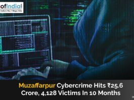 A hooded cybercriminal works on a laptop displaying lines of code, representing rising cyber fraud cases in Muzaffarpur, where scams caused a loss of ₹25.6 crore to over 4,000 victims in 10 months.