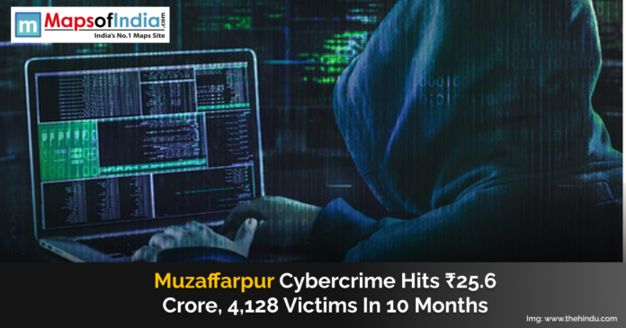 A hooded cybercriminal works on a laptop displaying lines of code, representing rising cyber fraud cases in Muzaffarpur, where scams caused a loss of ₹25.6 crore to over 4,000 victims in 10 months.