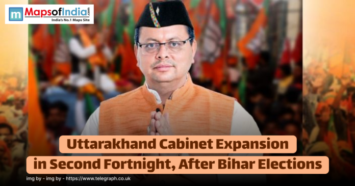 Uttarakhand Chief Minister greets supporters as reports announce a cabinet expansion planned for the second fortnight following the Bihar elections, amid a political gathering.
