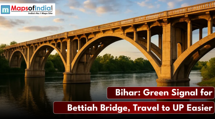 Bihar: Green Signal for Bettiah Bridge, Travel to UP Easier A low-angle photo of a concrete arch bridge (the Bettiah Bridge) spanning a river under a sunset sky, with the text "Bihar: Green Signal for Bettiah Bridge, Travel to UP Easier."