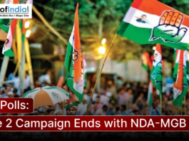 Political supporters wave party flags during a campaign rally in Bihar as the second phase of election campaigning concludes with a heated contest between the NDA and Mahagathbandhan alliances.