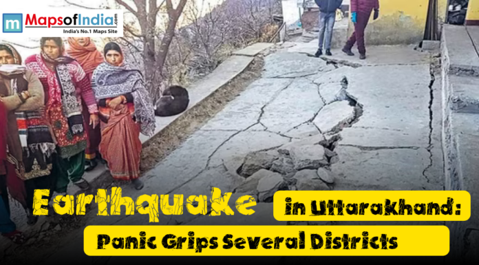 Earthquake in Uttarakhand: Panic Grips Several Districts People stand near a cracked and damaged road after an earthquake in Uttarakhand, showing visible destruction and concern among residents in affected districts.