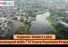 Gujarat: Shakri Lake Revamped with ₹17 Crore Fountain Project Aerial view of Shakri Lake in an urban area of Gujarat, with text announcing its revamp with a ₹17 Crore fountain project.