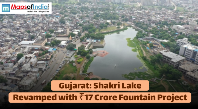Gujarat: Shakri Lake Revamped with ₹17 Crore Fountain Project Aerial view of Shakri Lake in an urban area of Gujarat, with text announcing its revamp with a ₹17 Crore fountain project.