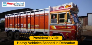 President’s Visit: Heavy Vehicles Banned in Dehradun Colorful Indian truck parked on a road with text announcing a ban on heavy vehicles in Dehradun during the President’s visit.